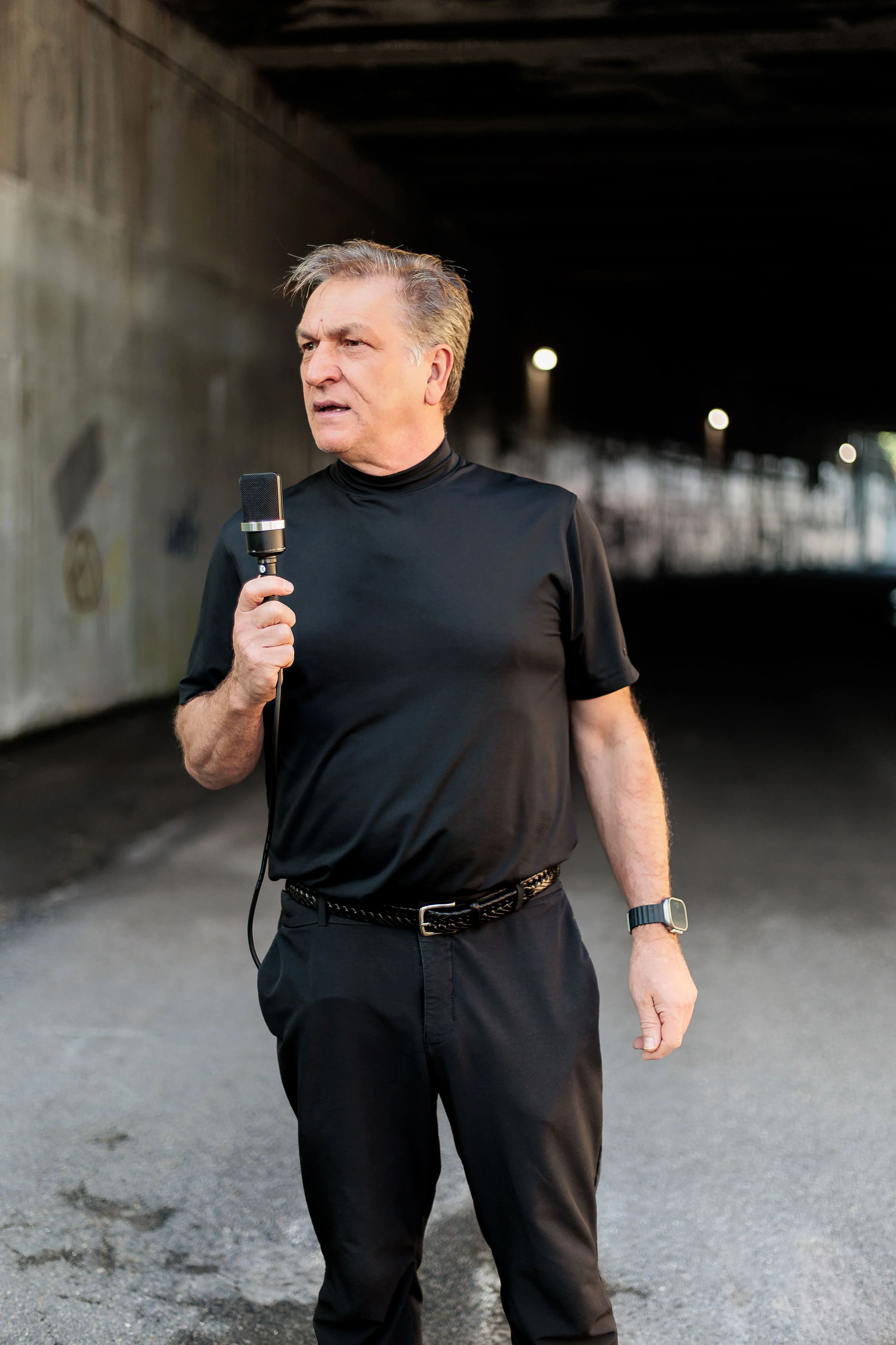 Jay Douglas holding a microphone